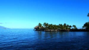 Hut at the waters edge in Tahiti