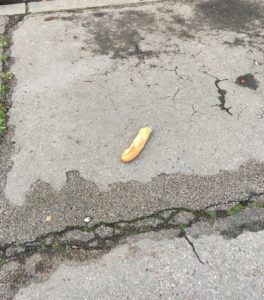 A single baguette on the street